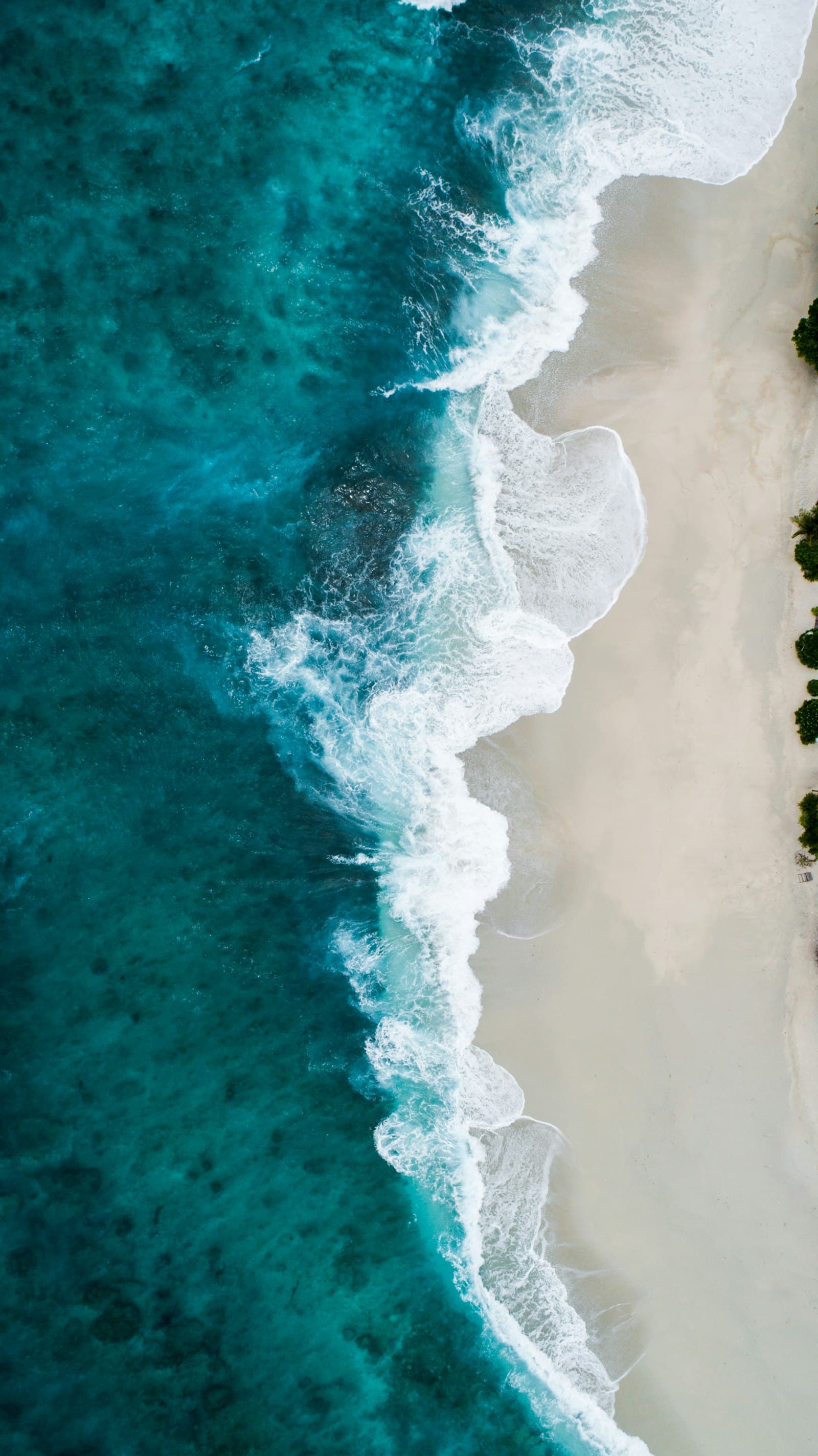 Aerial view of waves breaking on a coastline