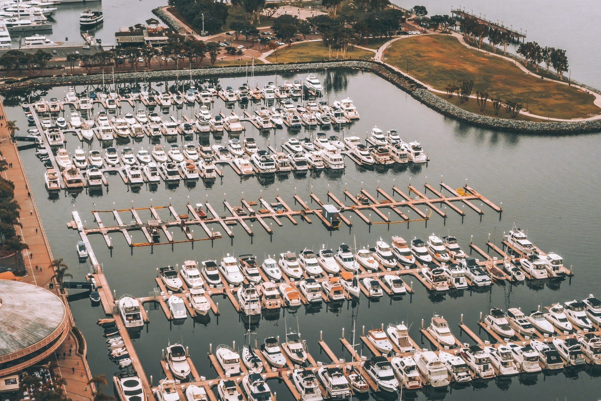 Aerial view of a marina filled with yachts and tenders