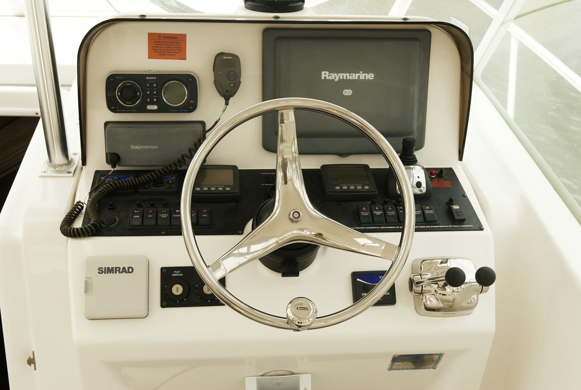 Yacht helm station with integrated navigation electronics